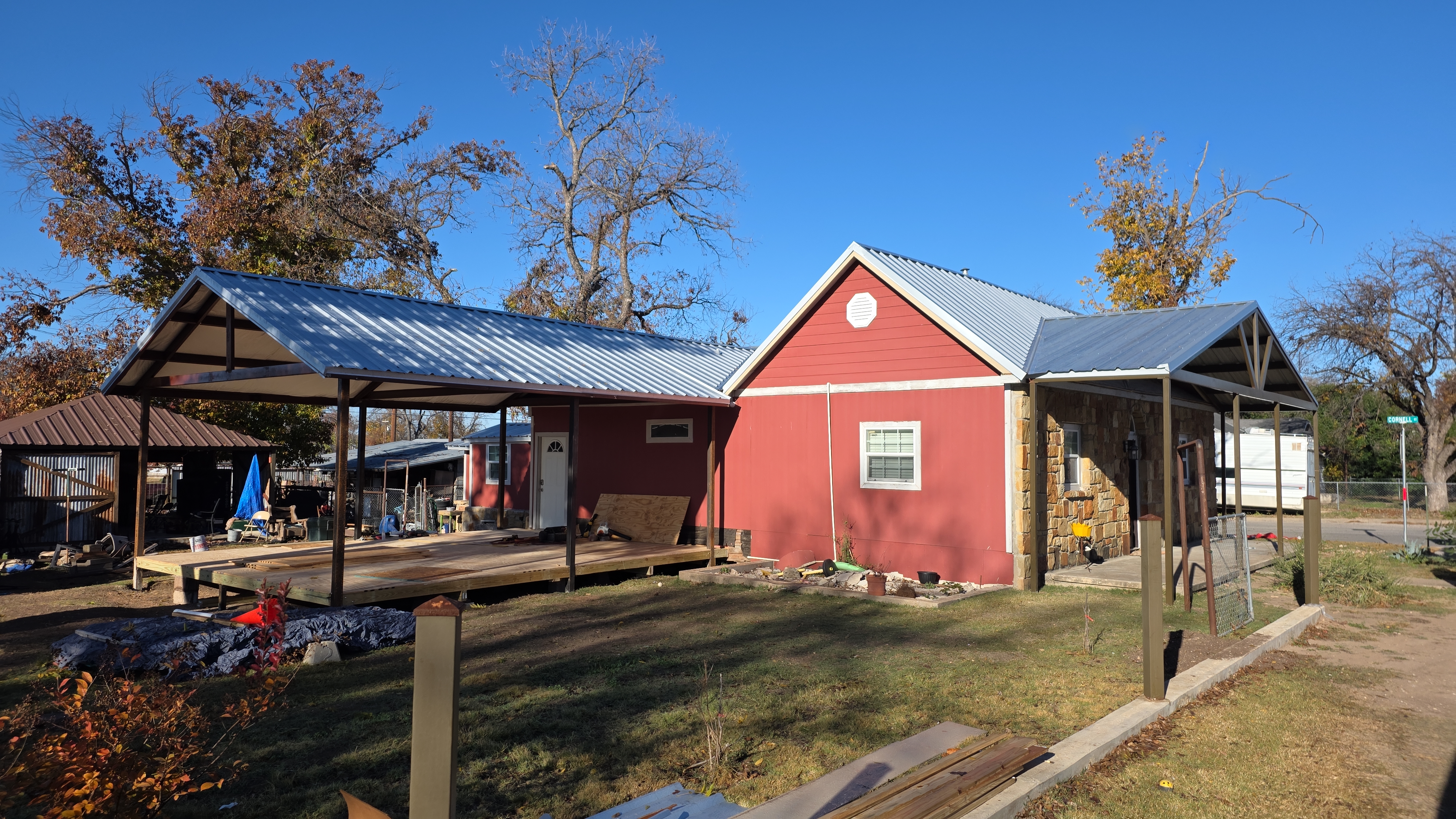 Red home with new metal roof