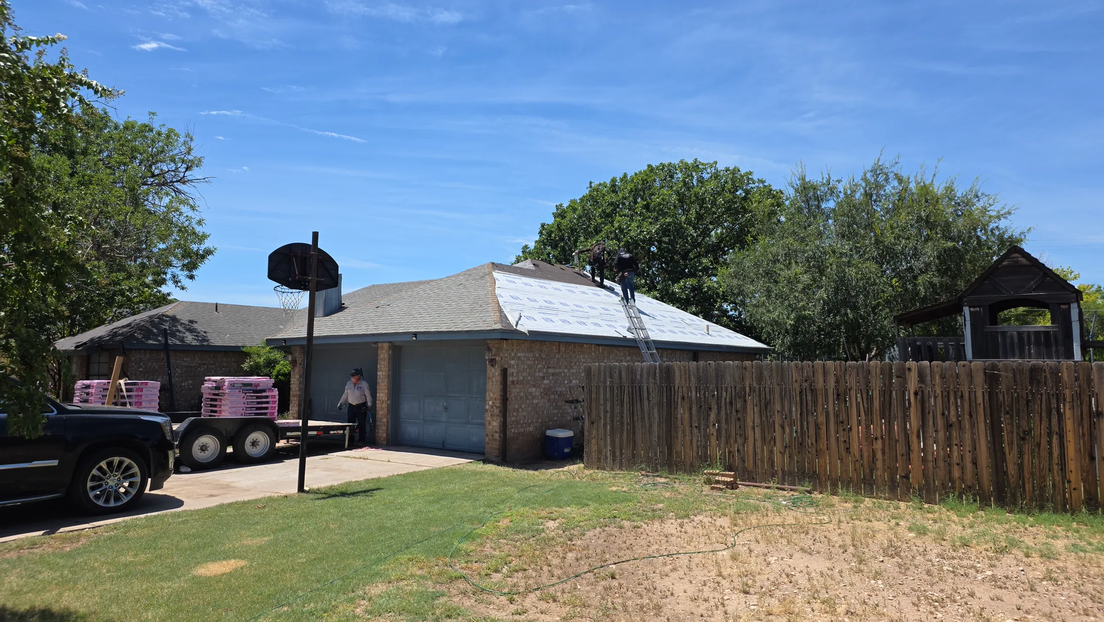 Wide view of a residential roofing project
